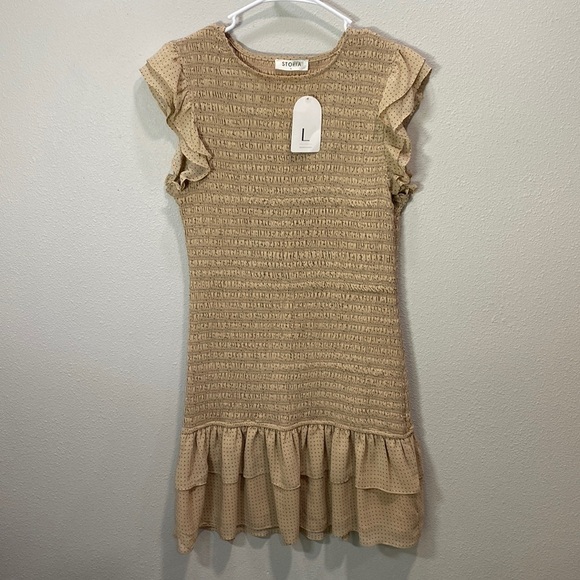 Storia Dresses & Skirts - Storia smocked dress cream tan ruffle bottom